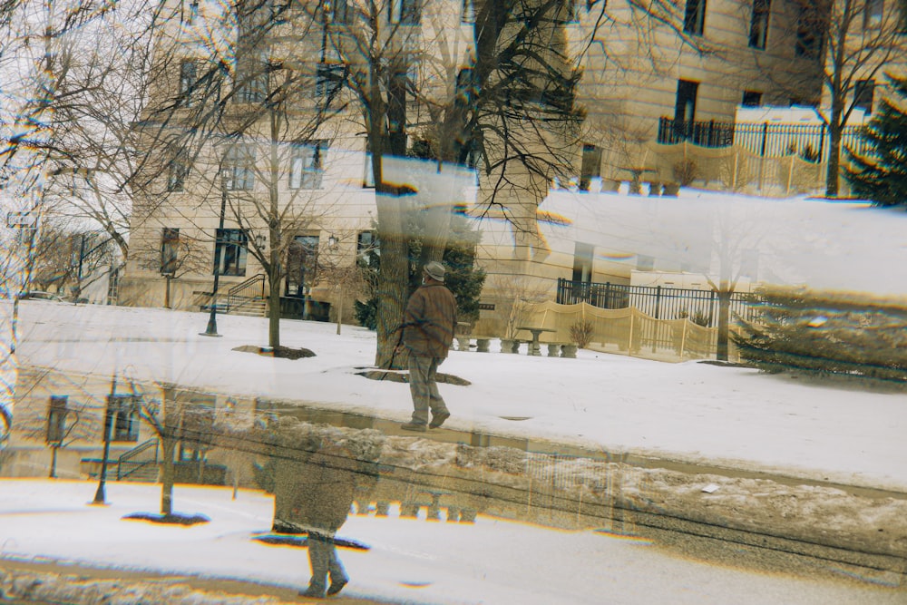 a blurry image of a person walking in the snow