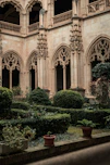 a large building with a bunch of plants in front of it