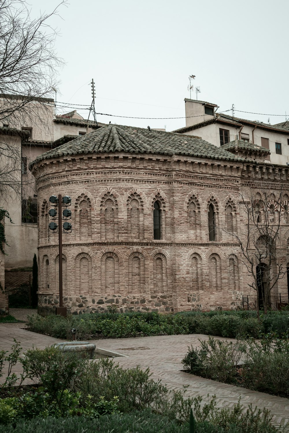 an old building with a clock on the front of it