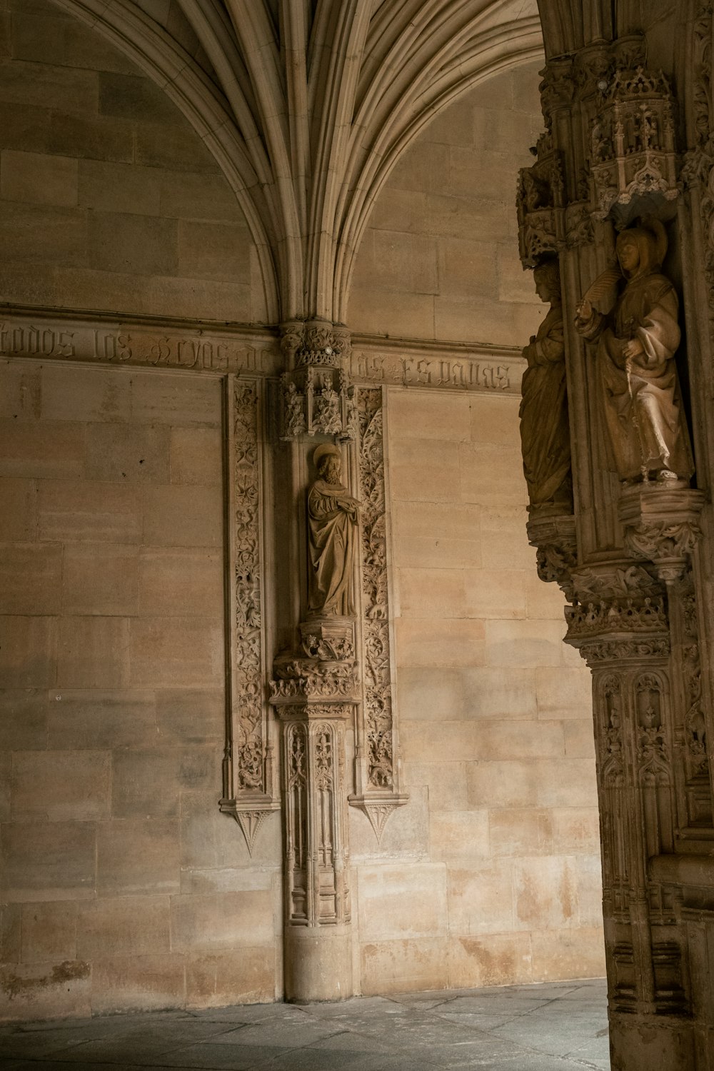 a statue of a woman on a pillar in a building