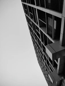 Black and white photo of a modern architectural building symbolizing strength and stability.