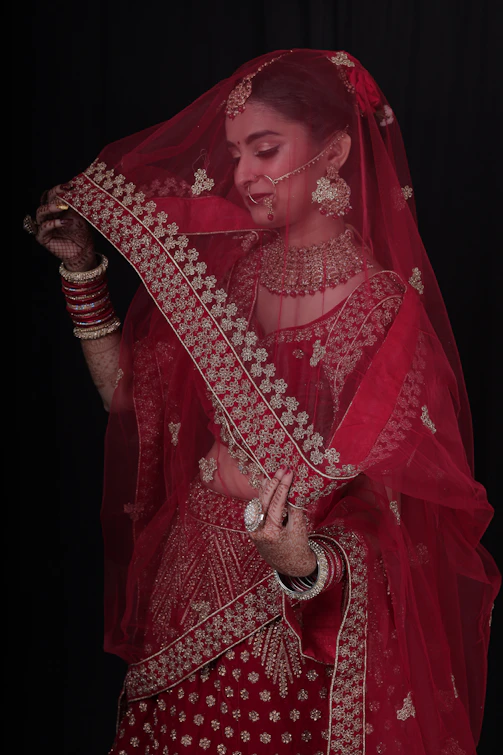 a woman in a red bridal outfit