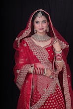 a woman in a red bridal outfit