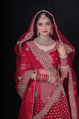 a woman in a red bridal outfit