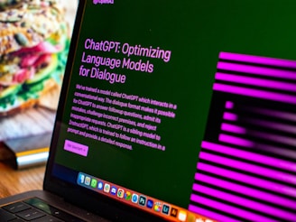 a laptop computer sitting on top of a wooden desk