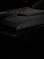 a black sports car in the dark