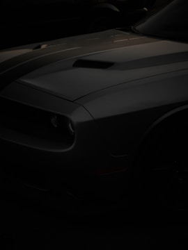 a black sports car in the dark