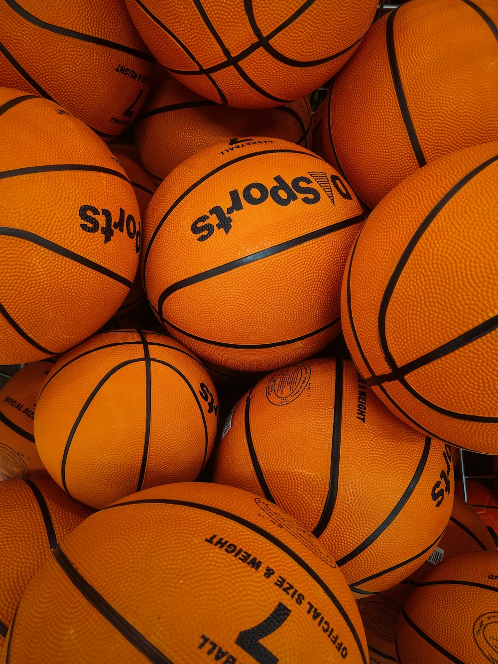 a pile of basketballs sitting on top of each other