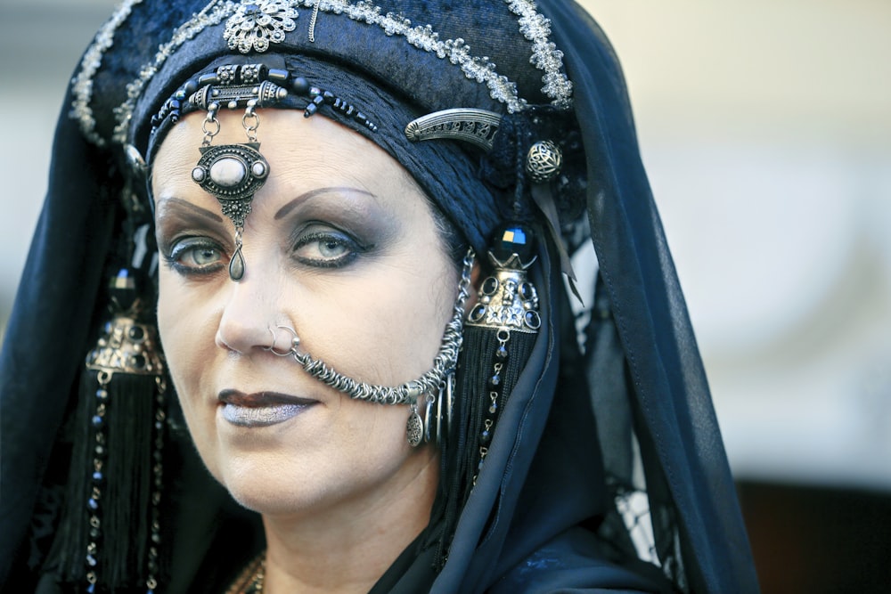 a woman wearing a black headdress and a black veil