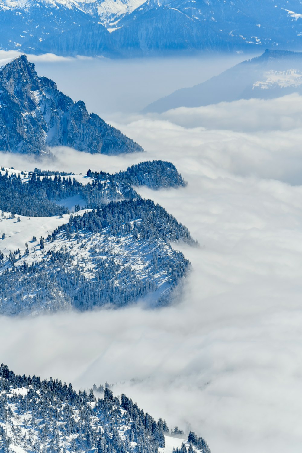 a view of a mountain range covered in snow