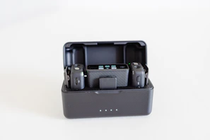 a couple of cameras sitting inside of a black case