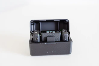 a couple of cameras sitting inside of a black case