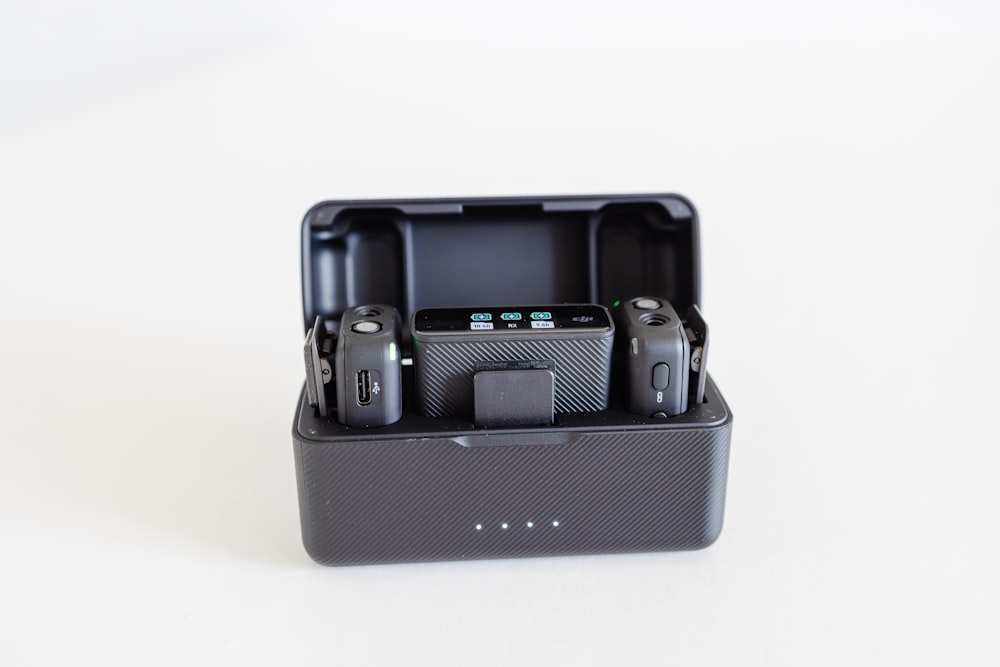 a couple of cameras sitting inside of a black case