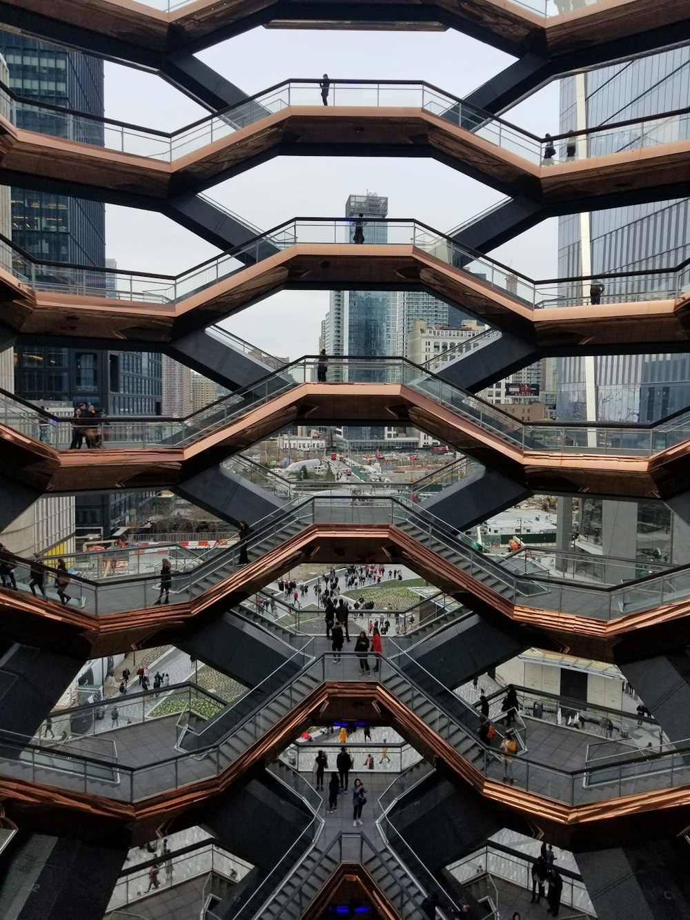 a group of people walking up and down some stairs