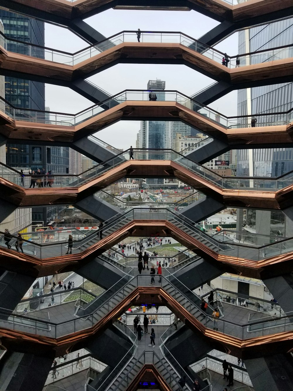 a group of people walking around a building