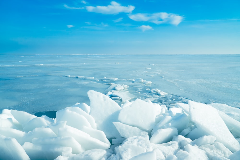 a large amount of ice floating on top of a body of water