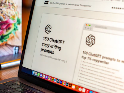 A laptop displays a webpage titled '150 ChatGPT copywriting prompts' with a logo above the text. It suggests using AI to improve copywriting skills. On the left, part of a colorful sandwich is partially visible, adding a contrast to the academic theme on the screen.