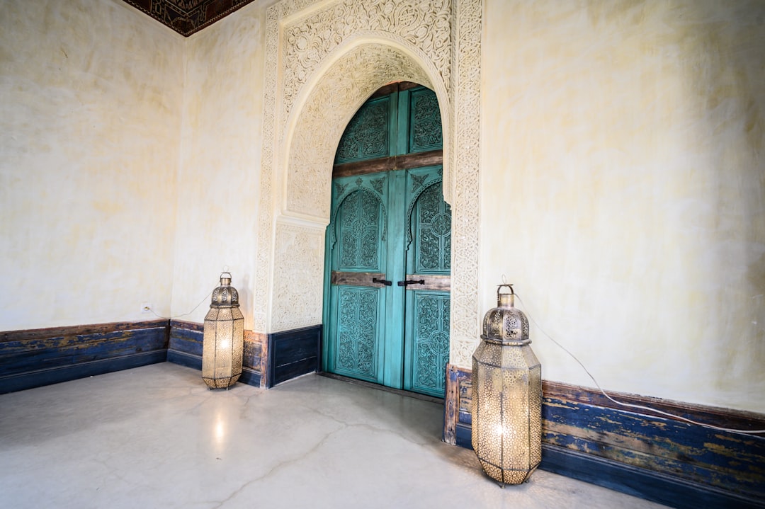 a couple of lanterns sitting in front of a blue door, ELLA DON on the streets of Marroco 2022 Ella Don was captivated by