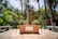 A beautifully designed garden featuring native plants and a tranquil seating area.