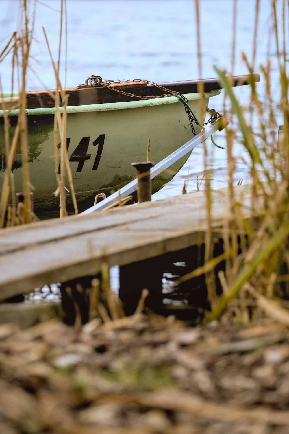 a small boat sitting on top of a body of water