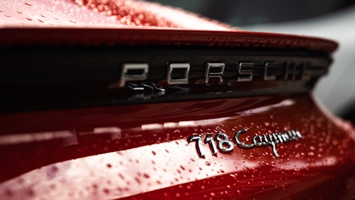 Close-up of a gleaming Porsche Cayenne after ceramic coating application.