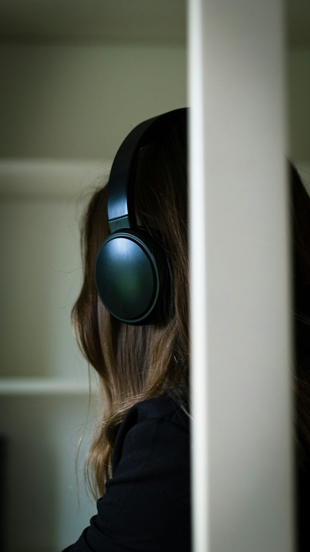 a woman with headphones on her ears