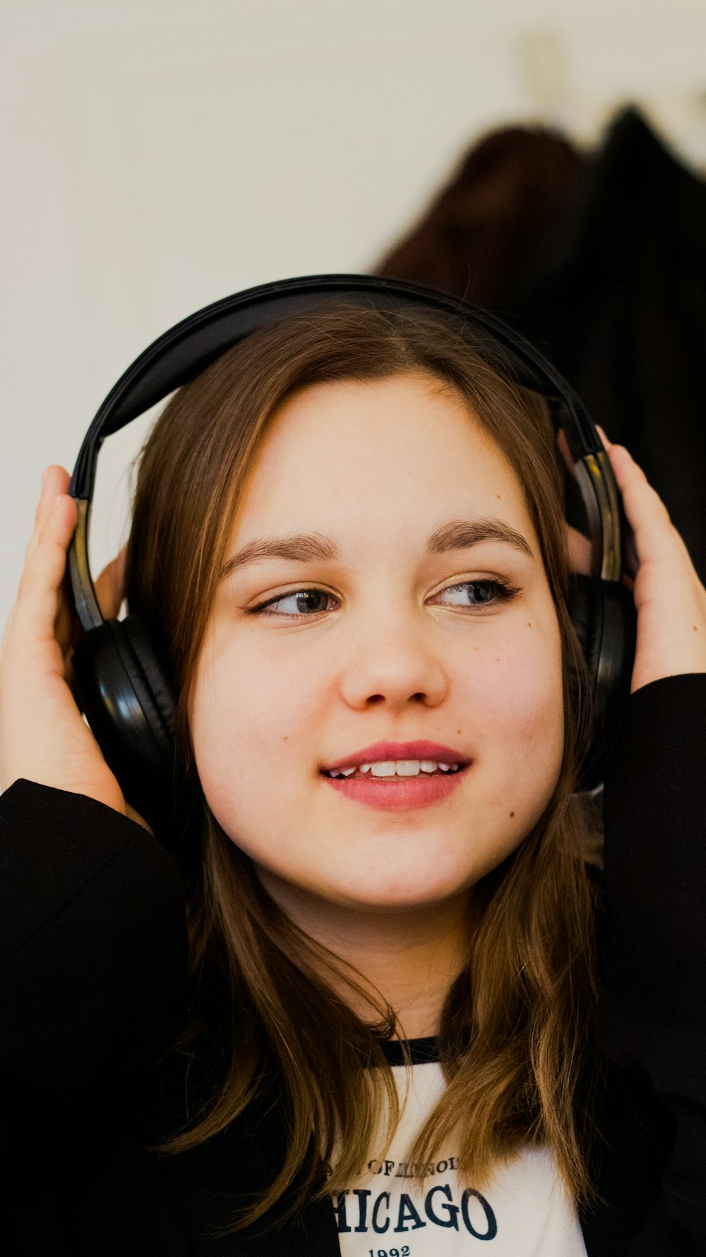 a girl with headphones on her ears