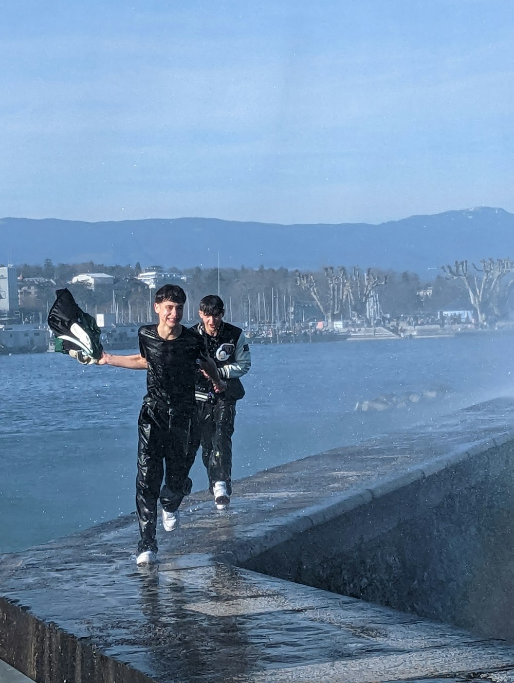 a couple of people that are standing in the water