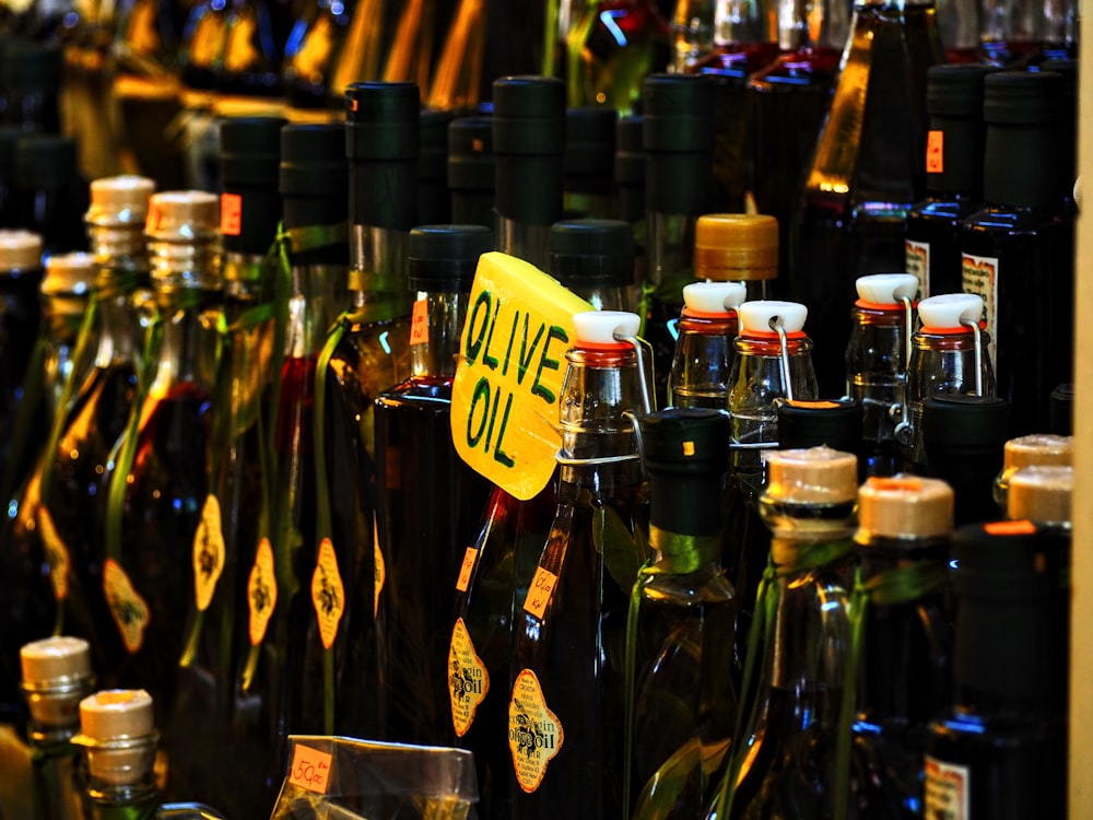 bottles of olive oil are on display in a store