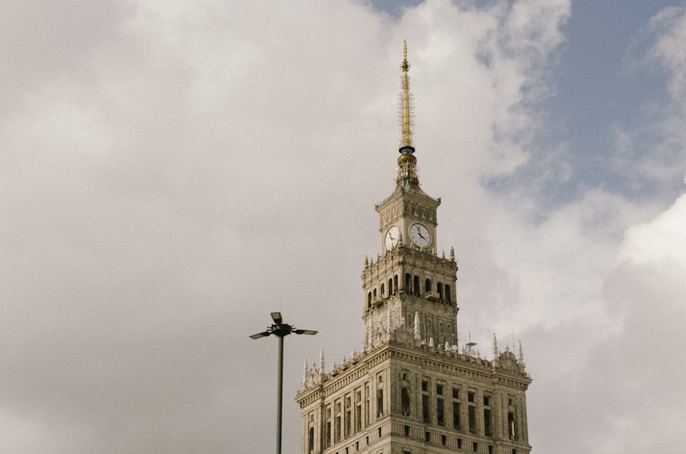 a tall building with a clock on the top of it