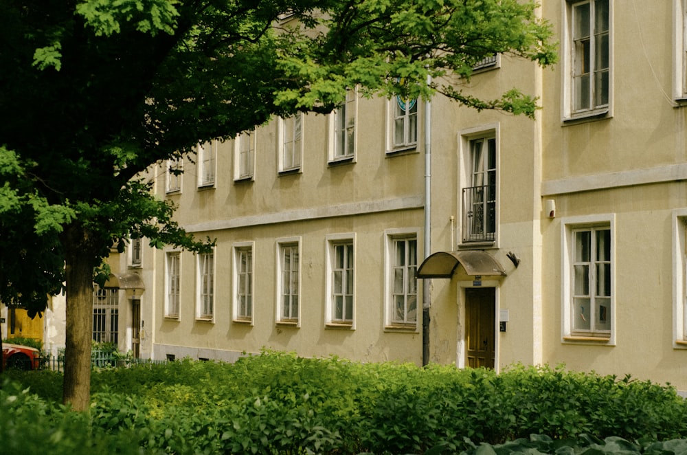 a building with many windows and a clock on the front of it