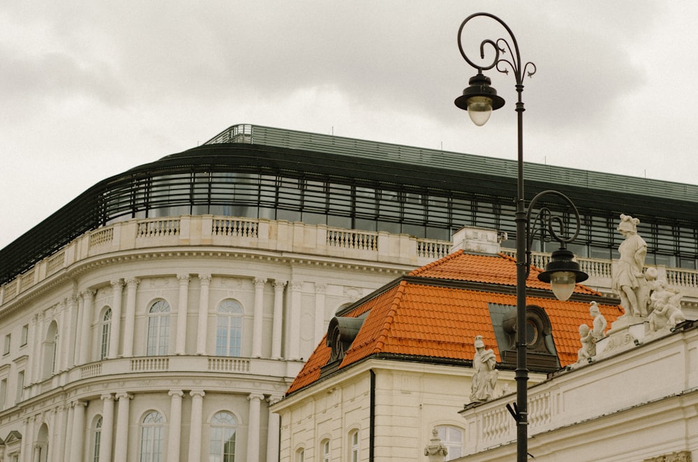 a street light with a building in the background