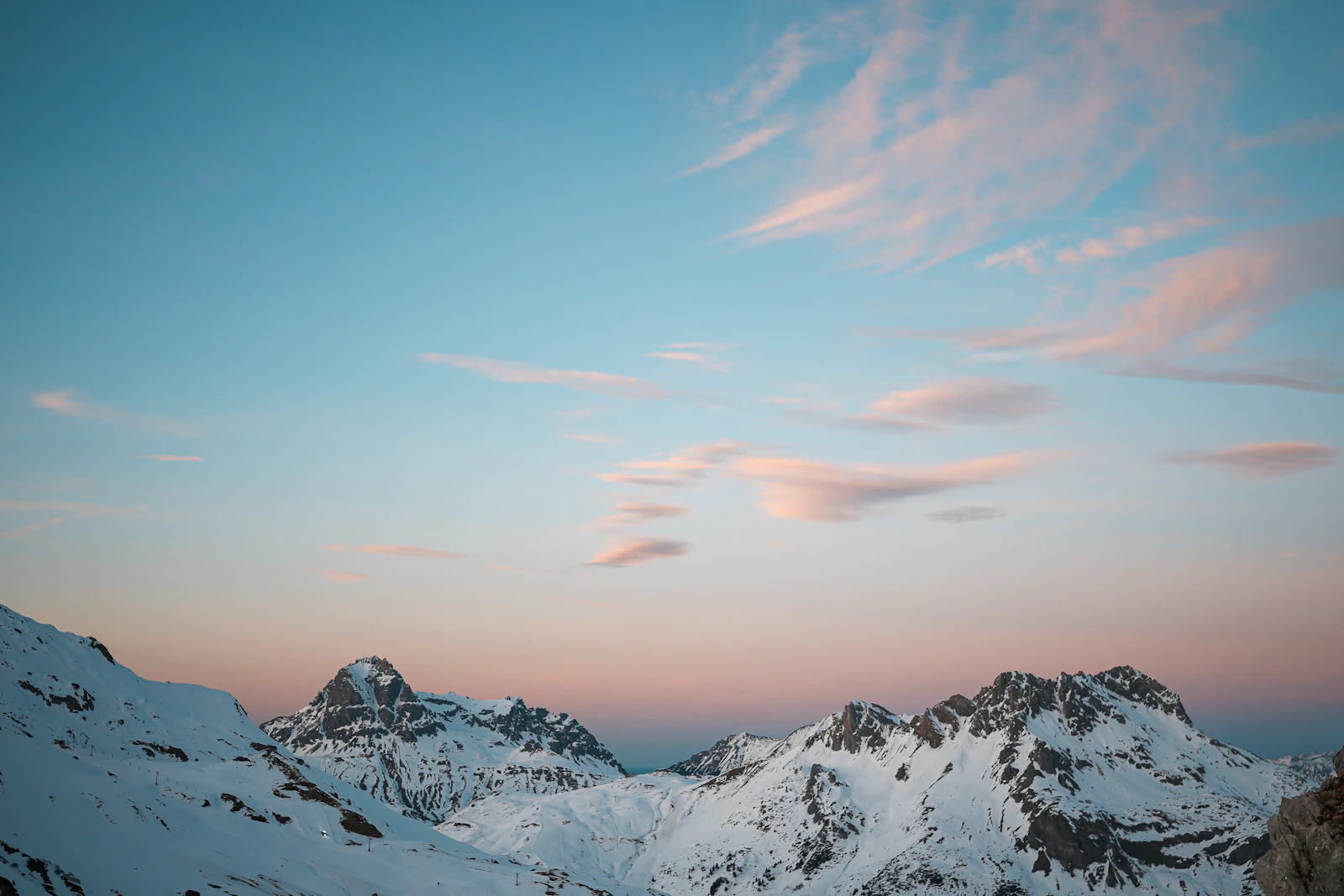 Arlberg mountain range at sunset in winter