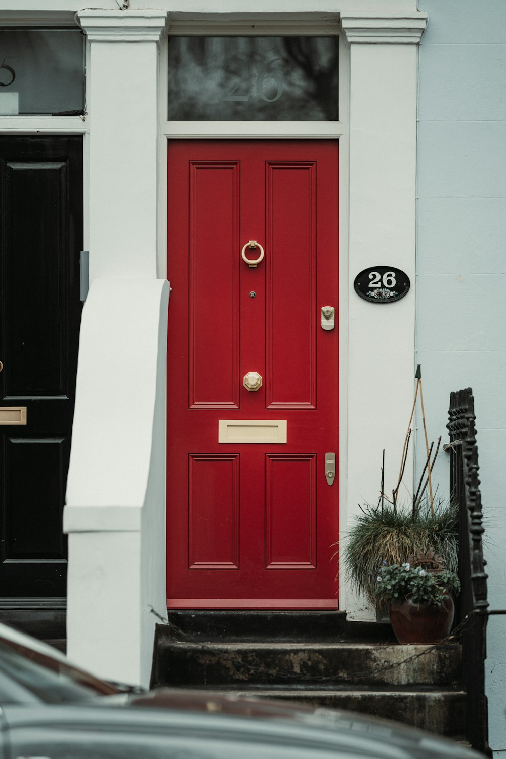 a red door with a black door and a white door