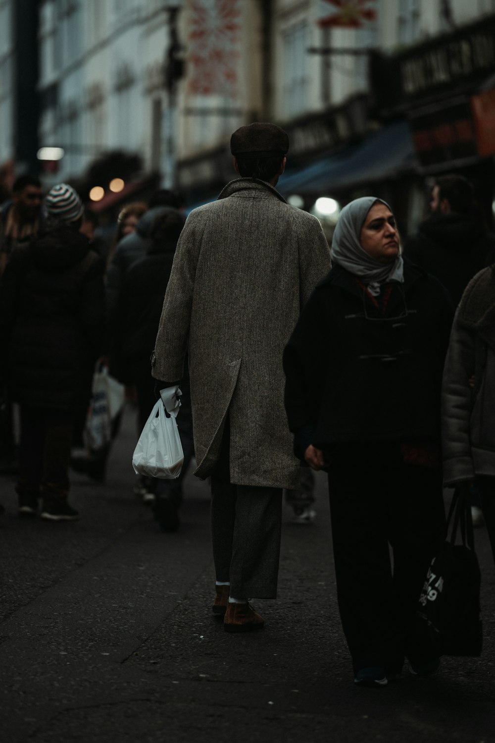 a group of people walking down a street