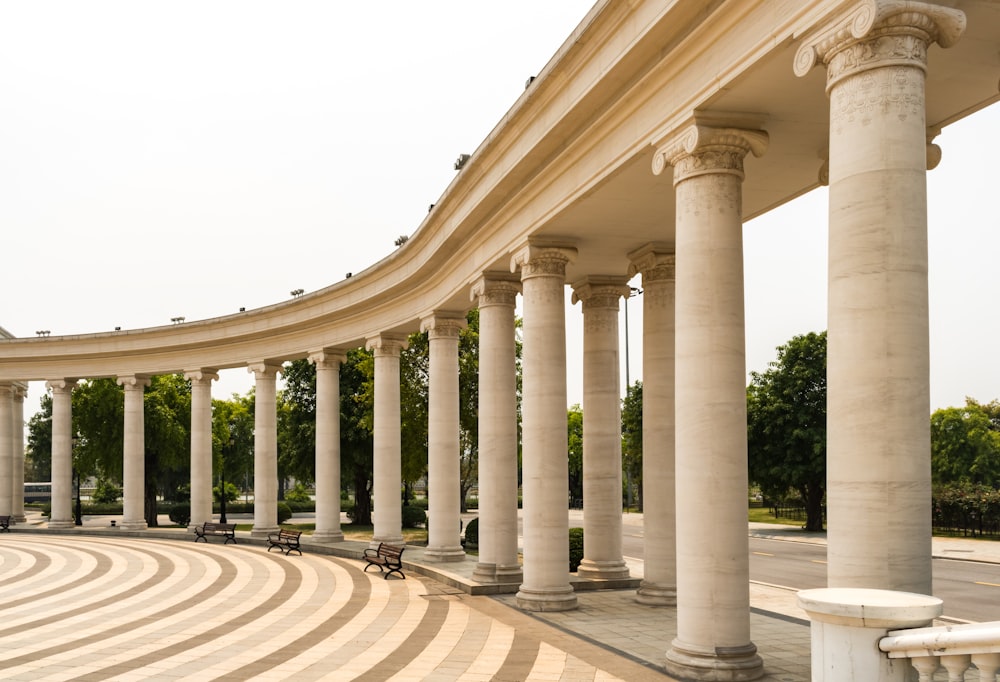 a row of white pillars sitting next to each other