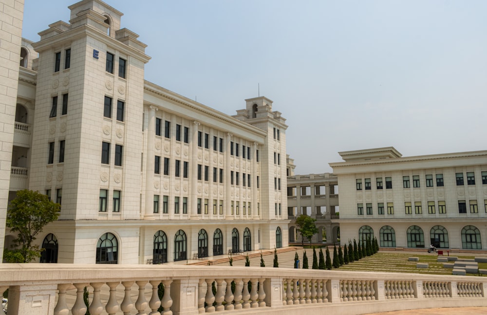 a large white building with many windows and balconies