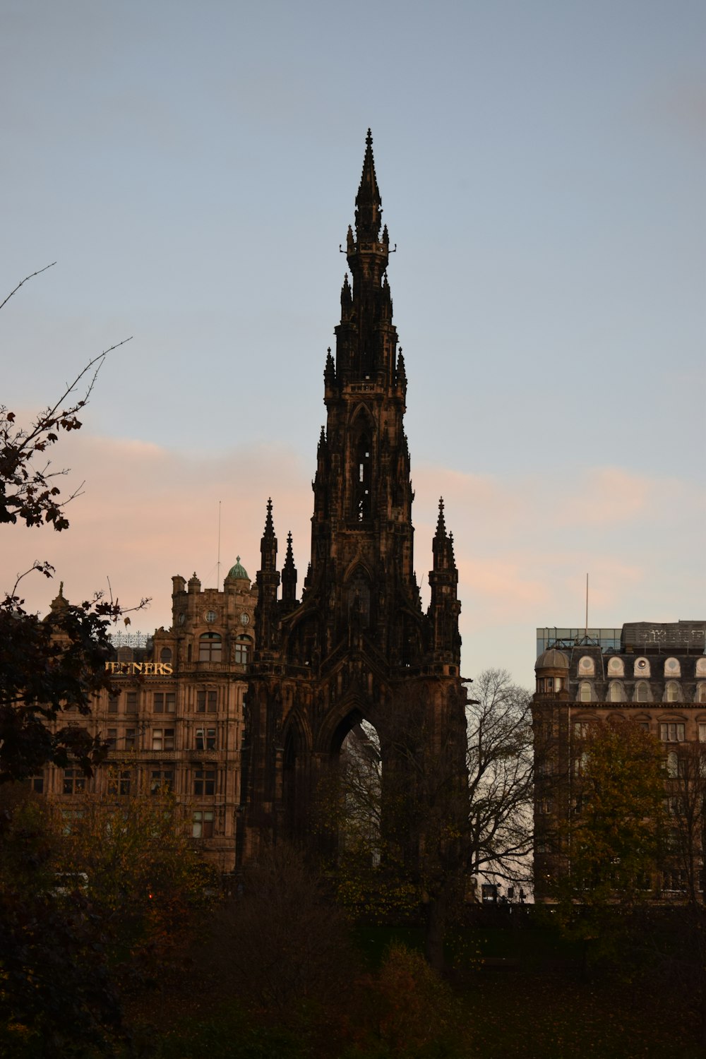 a very tall tower with a clock on it's side