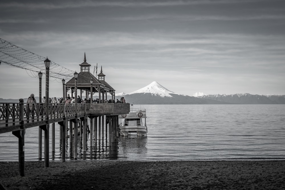 a pier with a mountain in the background