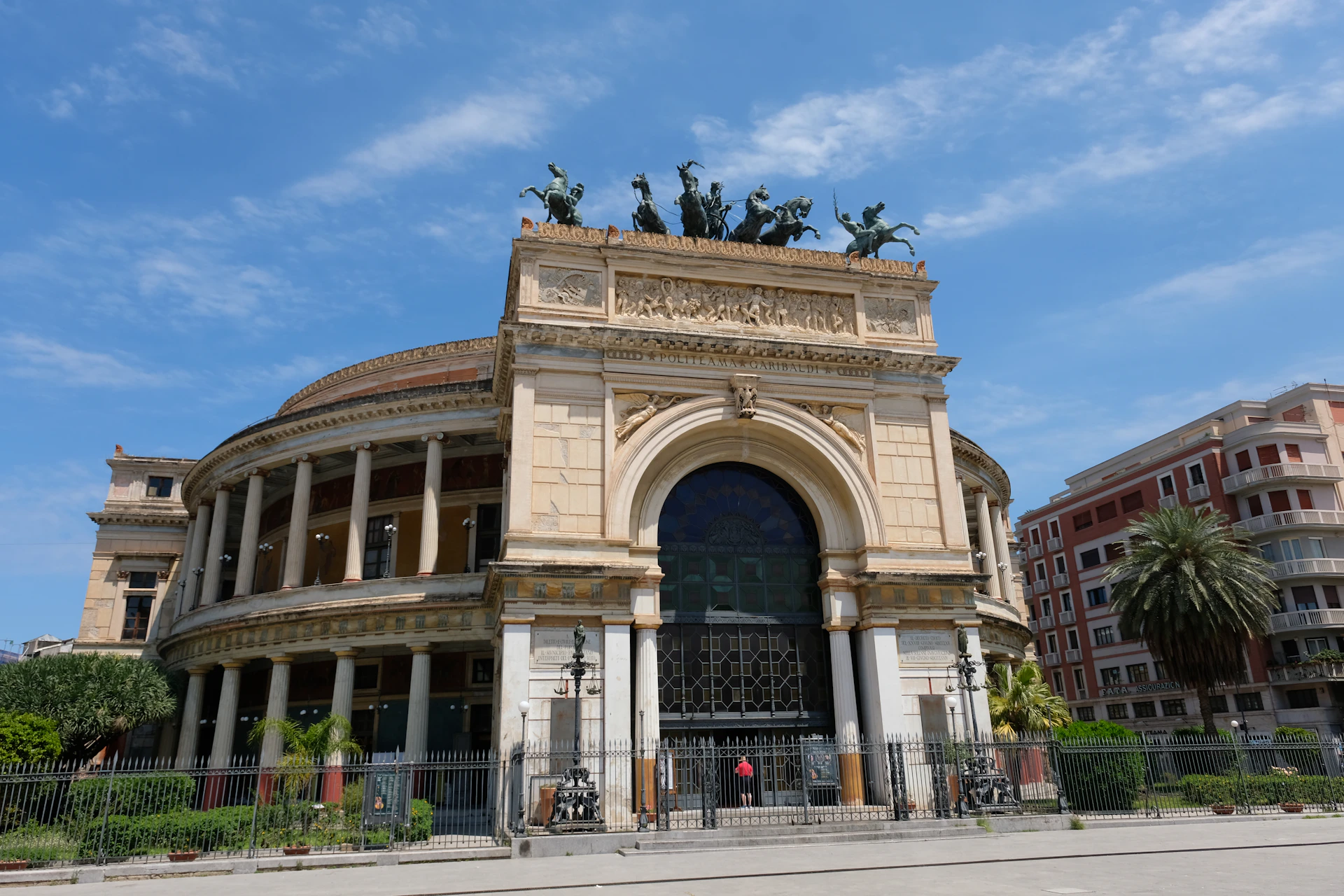a large building with statues on top of it