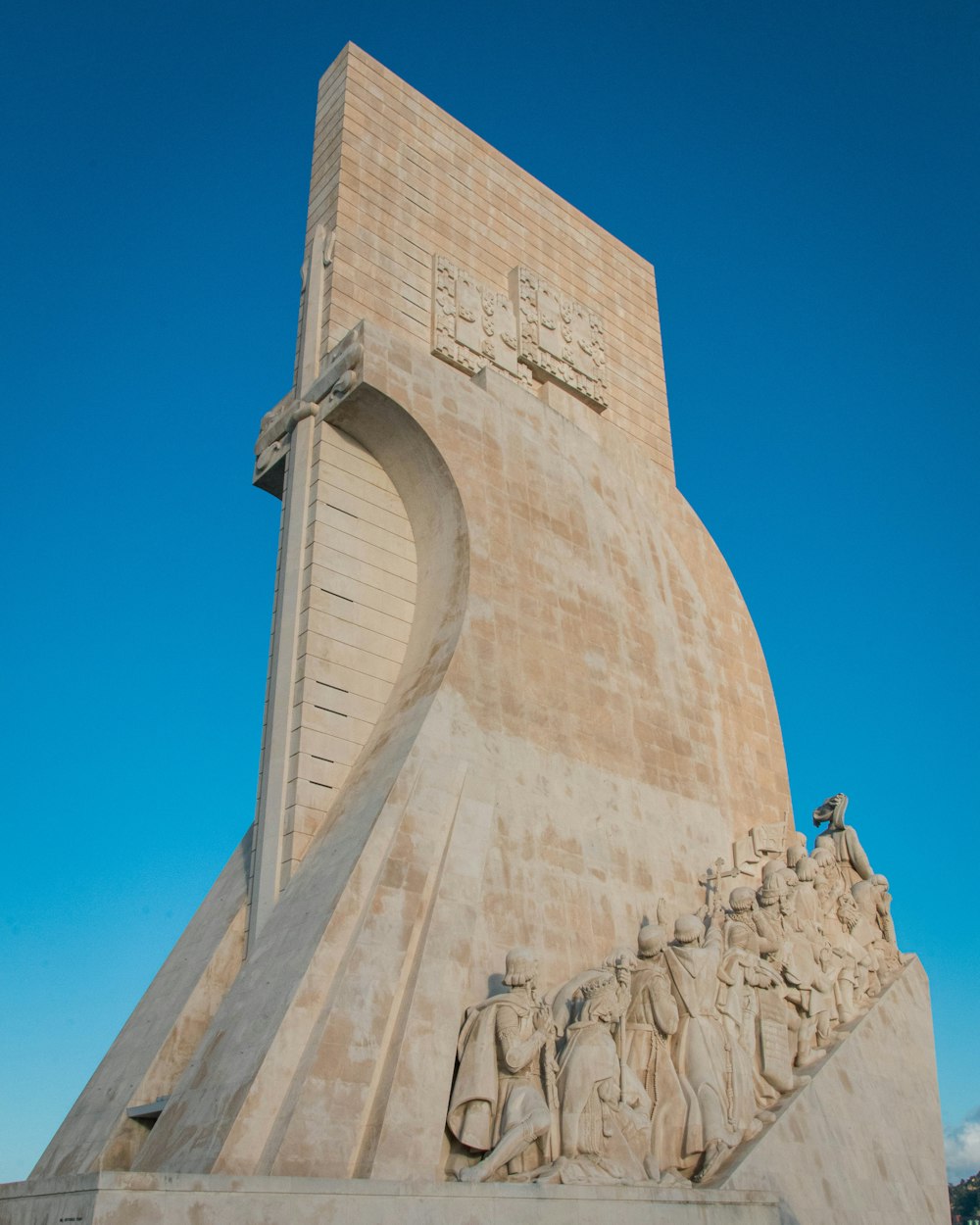 a large monument with statues on the side of it