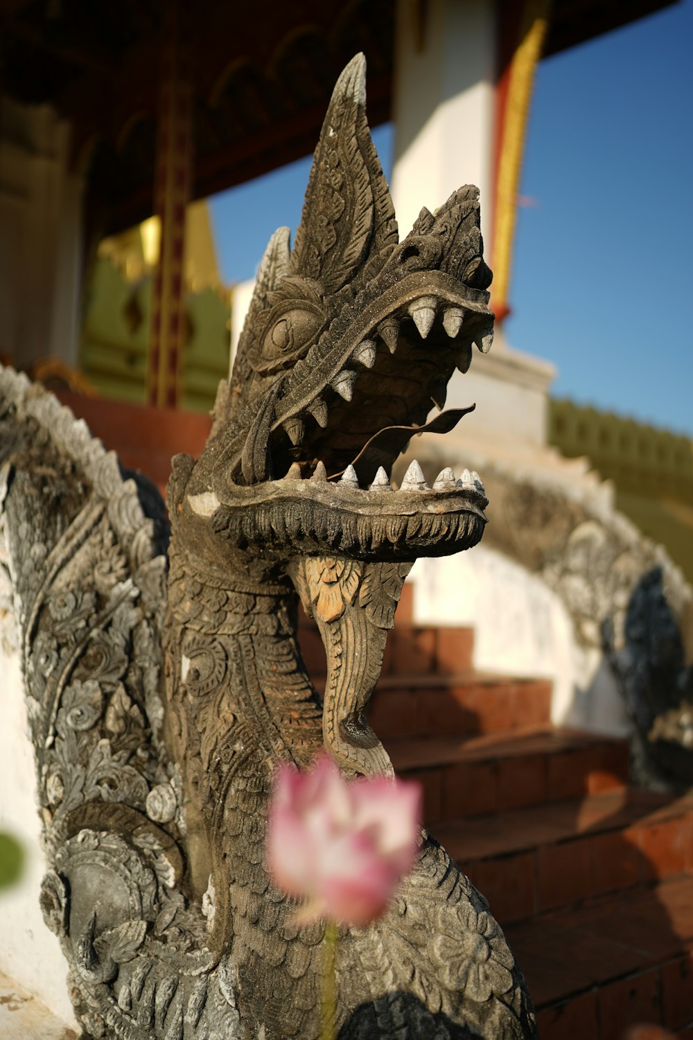 a statue of a dragon with its mouth open