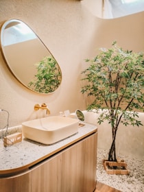 Elegant guest bathroom featuring natural textures and clean, contemporary fixtures.