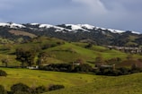 A peaceful landscape of rolling hills with farmland.