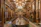Luxurious royal dining table with intricate golden carvings and matching chairs crafted from premium teakwood.