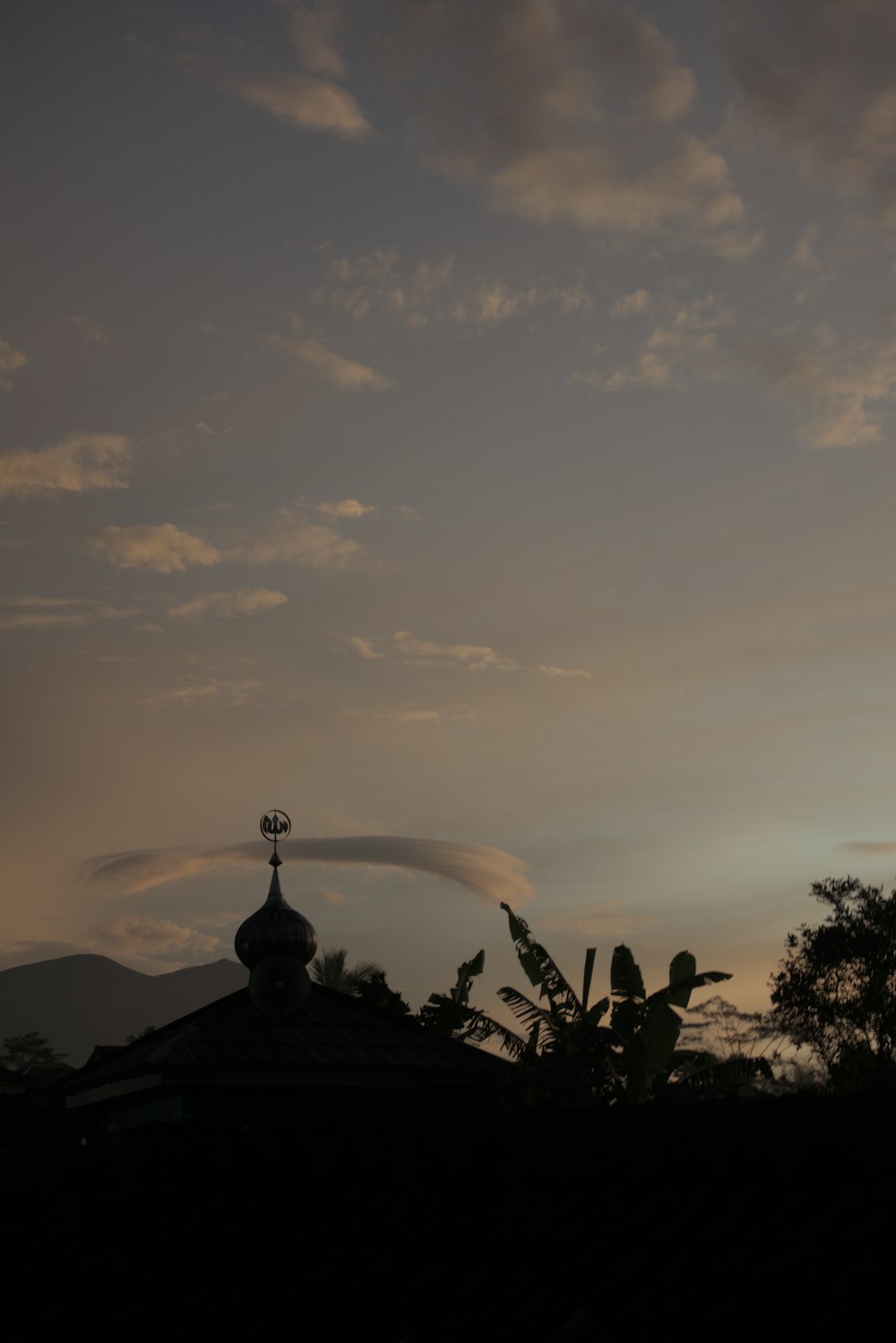 a view of a building with a clock tower in the distance