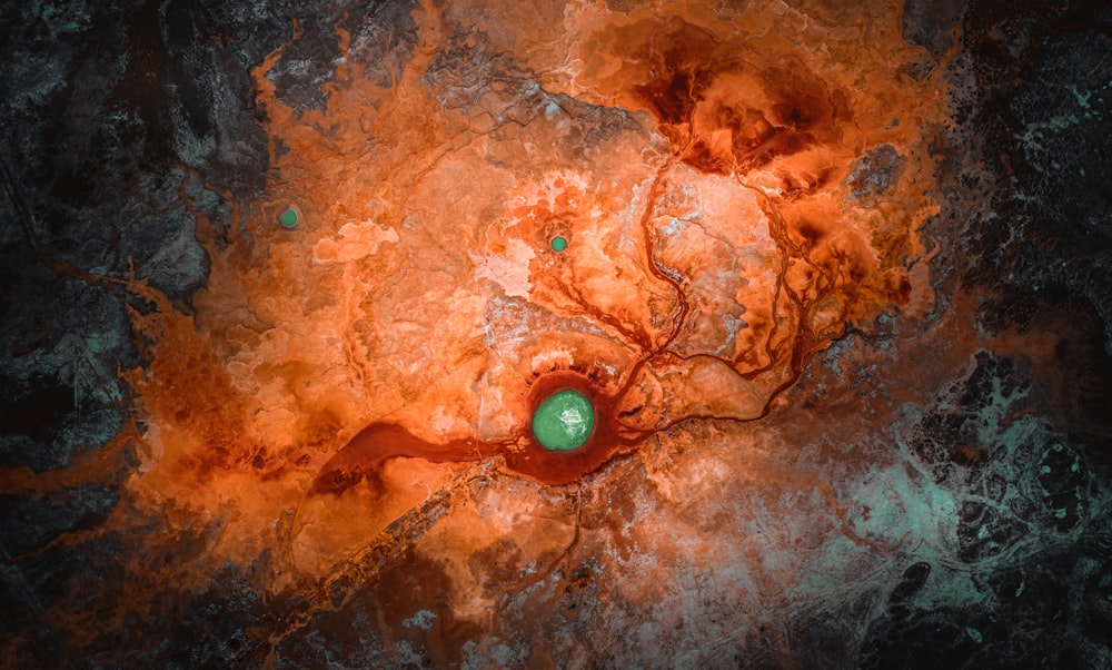 an aerial view of an orange and green substance