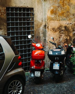 a couple of scooters parked next to each other