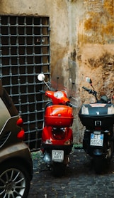 a couple of scooters parked next to each other