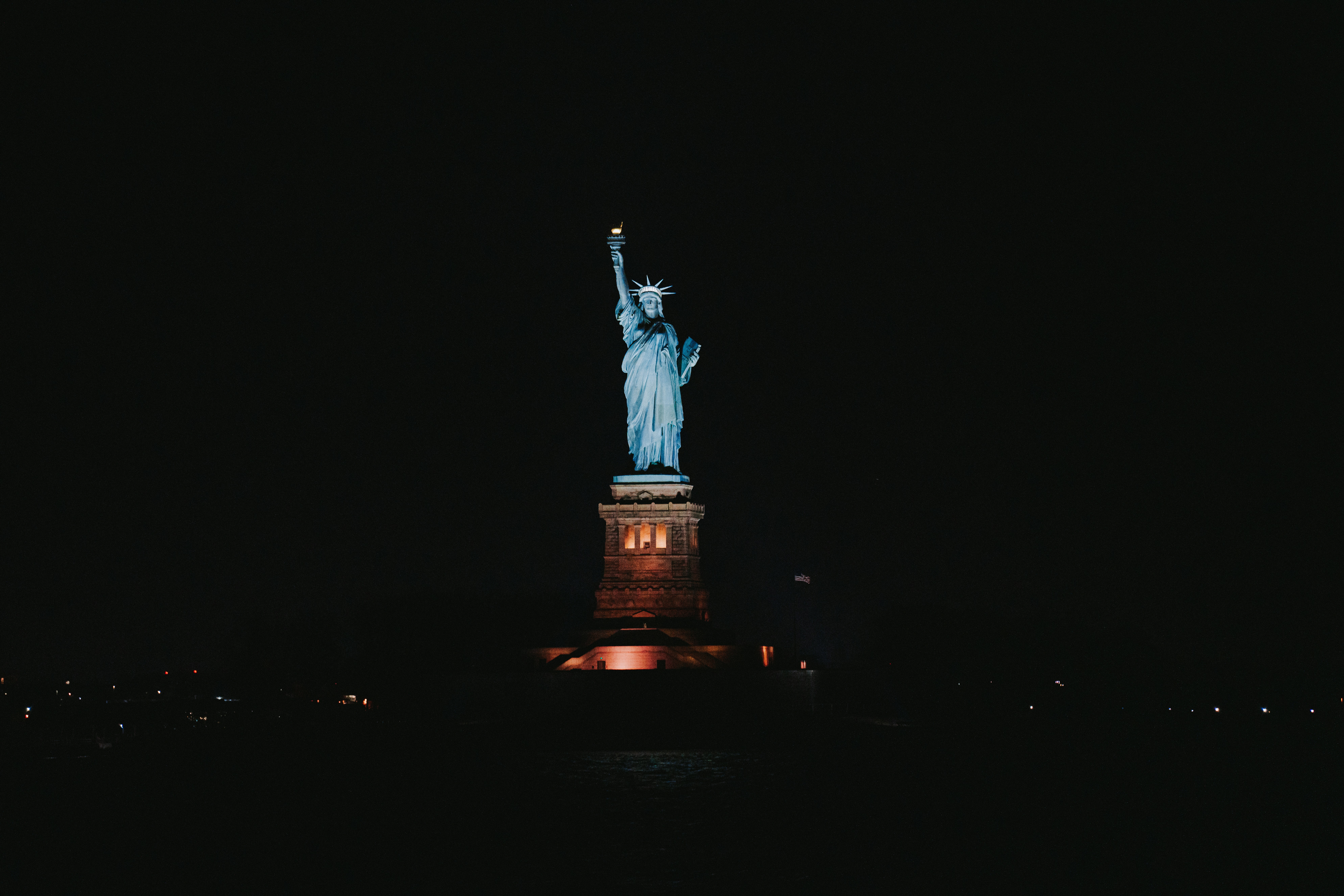 The statue of liberty lit up at night photo Free New york Image on